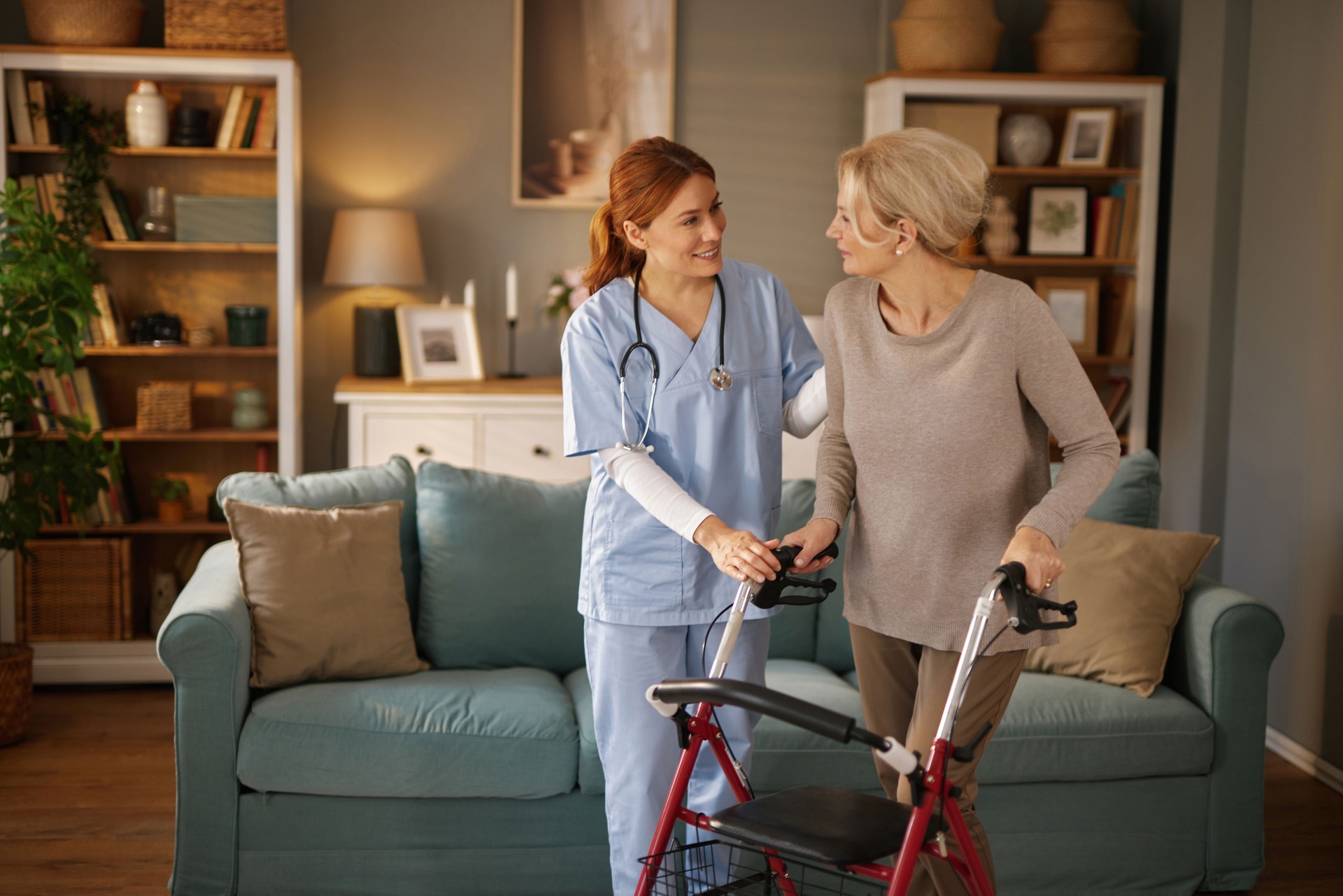 Home health nurse in Port Charlotte FL helping elderly woman walk safely